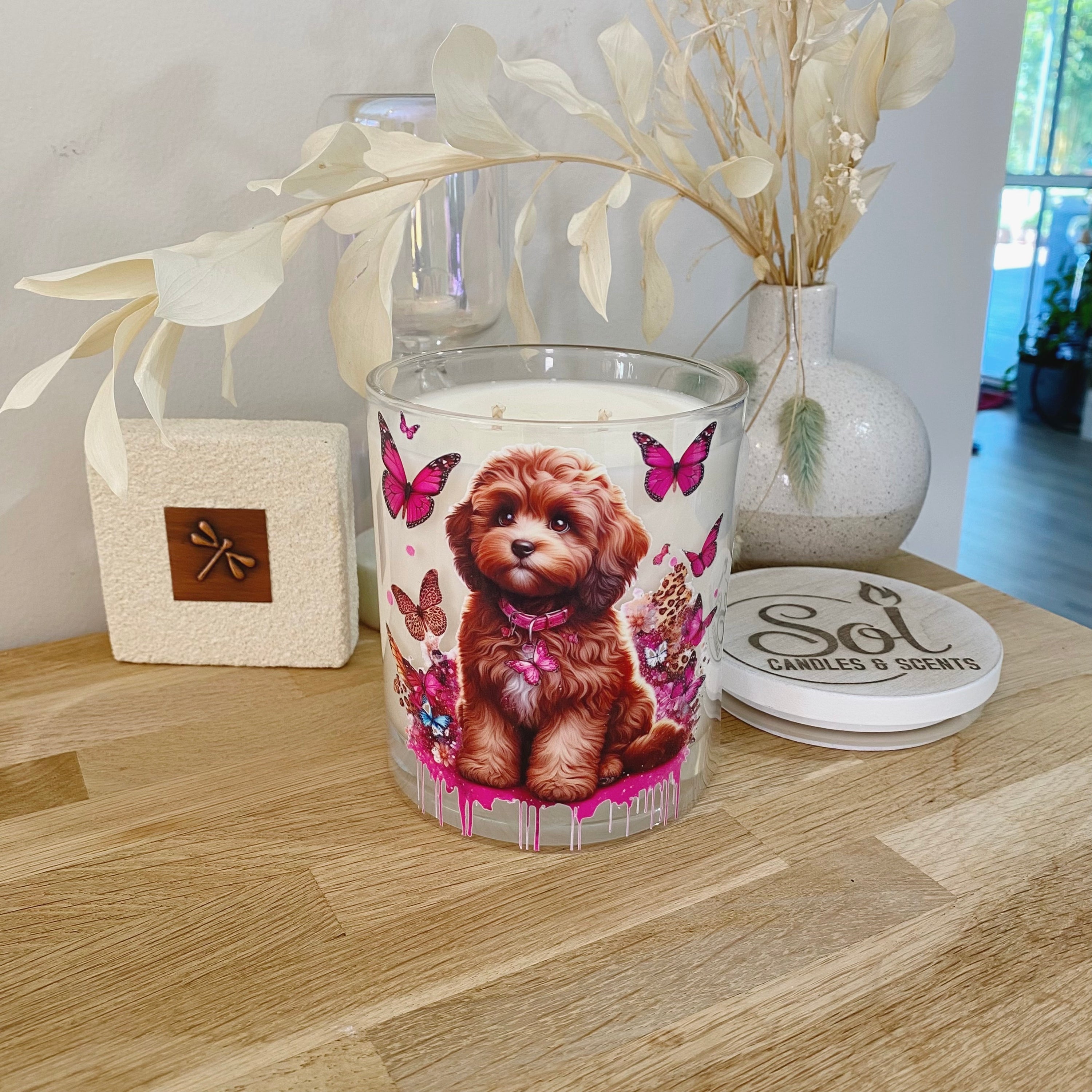 Xlarge Candle with a Cavoodle Chocolate Dog Sitting Surrounded with Butterflies_Designed by Sol Candles & Scents
