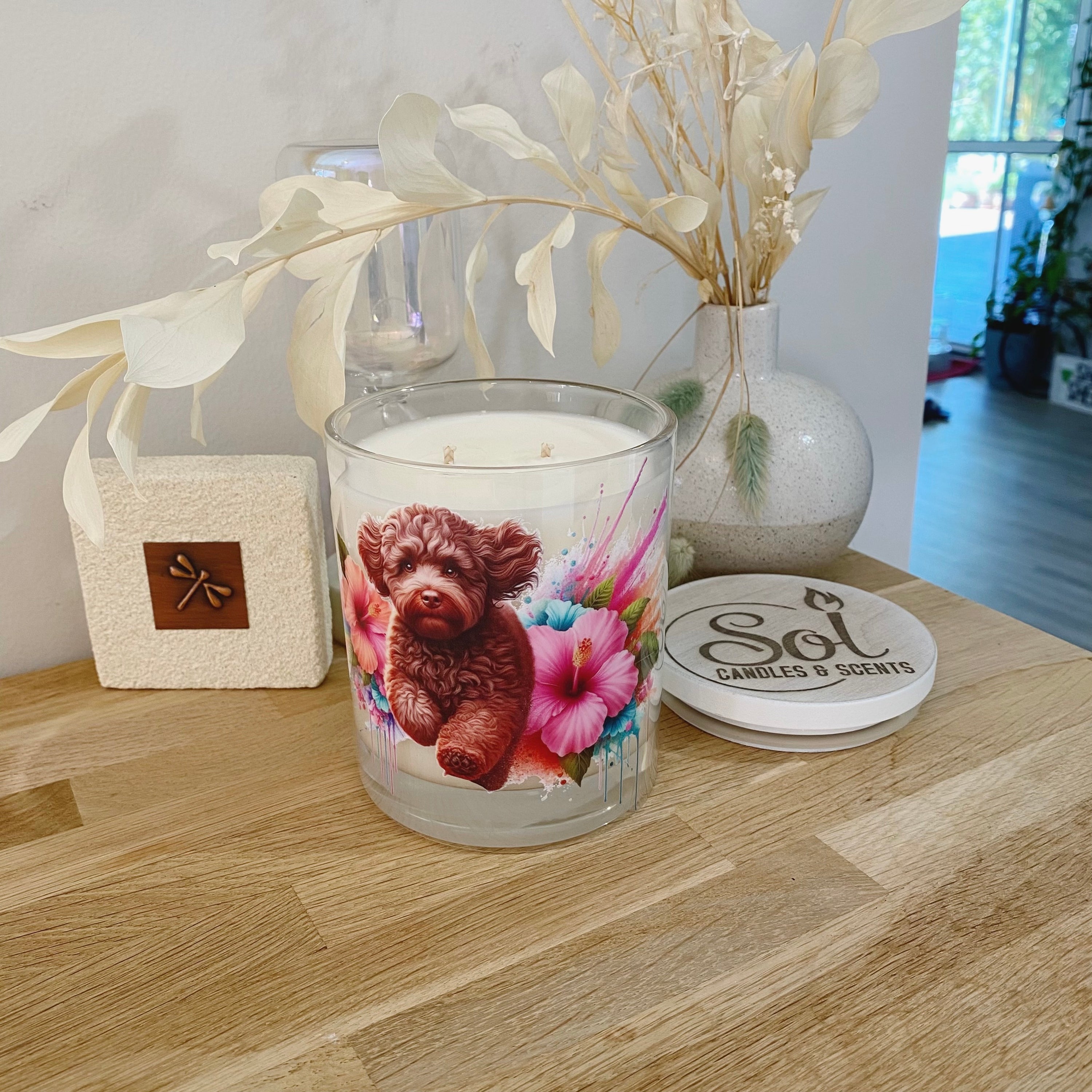 Soy Candle with a Chocolate Cavoodle dog running through flowers_Sol Candles & Scents