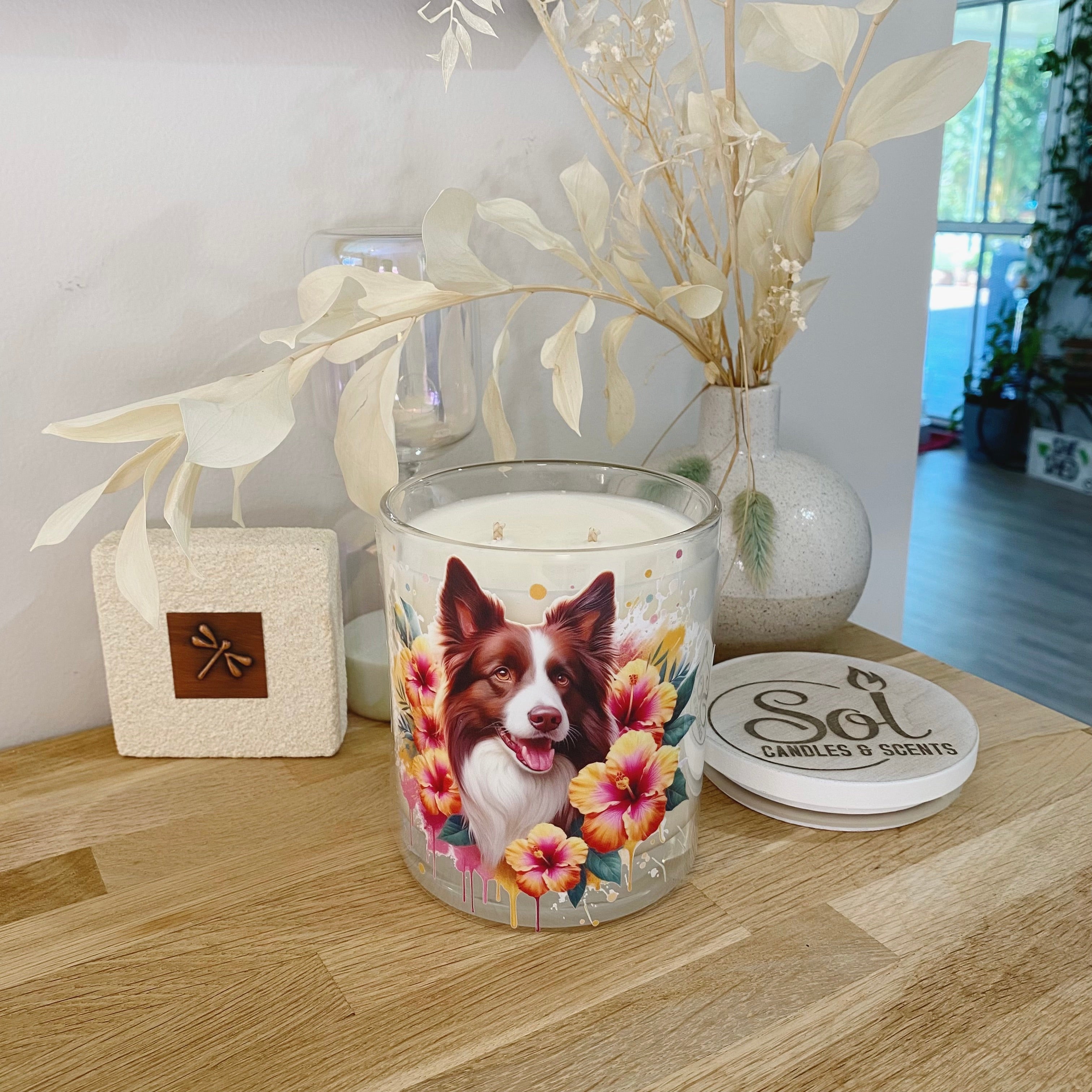 Border Collie Chocolate with Hibiscus Flowers Photo on a Xlarge Candle_Sol Candles &amp; Scents