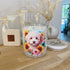 Soy Candle with a Cavoodle dog and floral design_ Made by Sol Candles & Scents