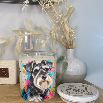 A portrait of a Schnauzer on a colourful background placed onto a Soy Candle