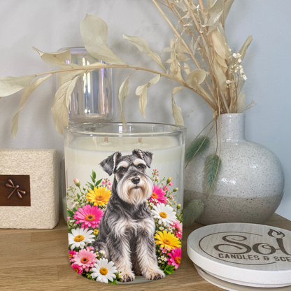 Schnauzer Dog Sitting in a bed of Bright Florals. Placed onto a Soy Candle. Sol Candles &amp; Scents